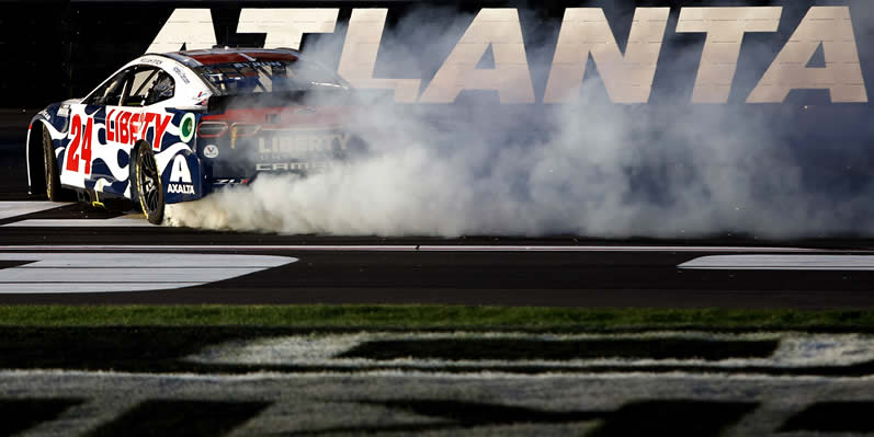 William Byron celebrates with a burnout