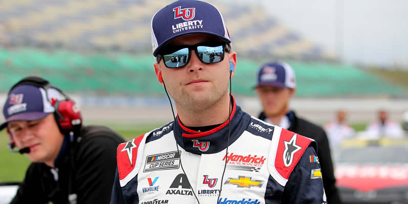 William Byron walks the grid during qualifying